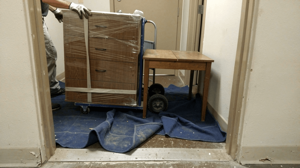 Wrapped apartment furniture prepared for a San Angelo residential move