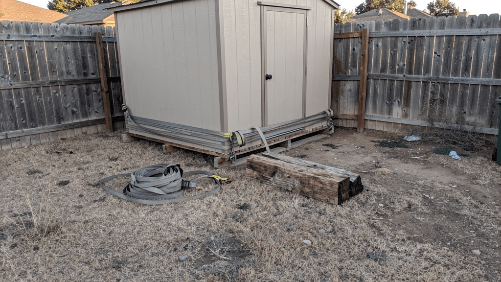 Backyard storage shed prepared for moving at a San Angelo property