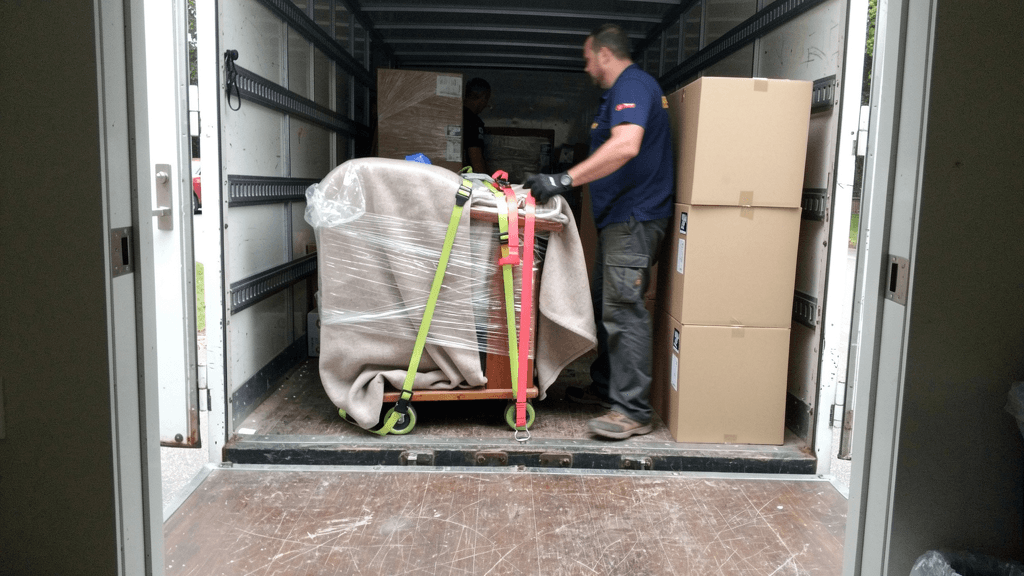 Wrapped household items being loaded for a long-distance move